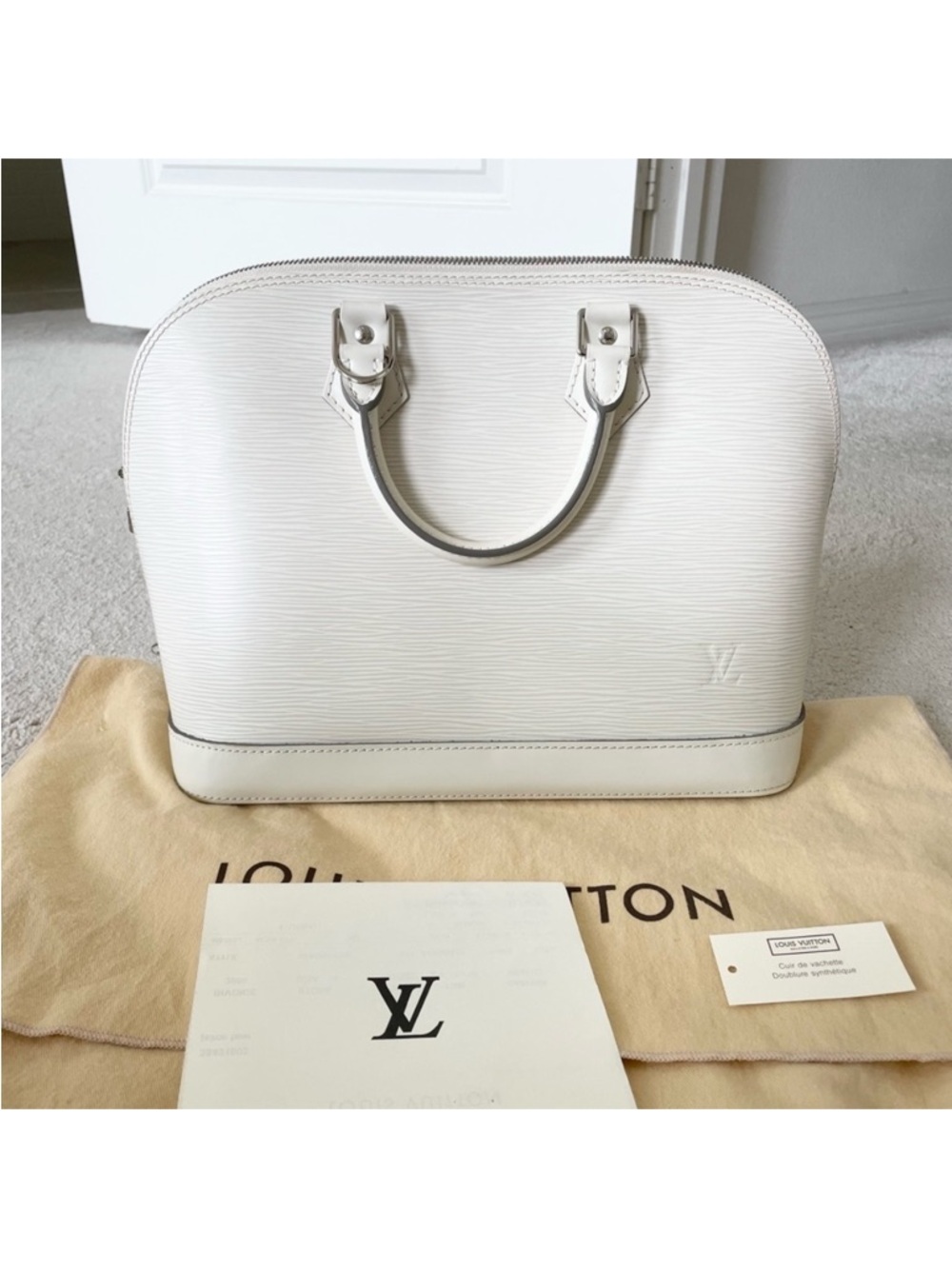 Authentic Louis Vuitton ivory EPI Alma PM bag